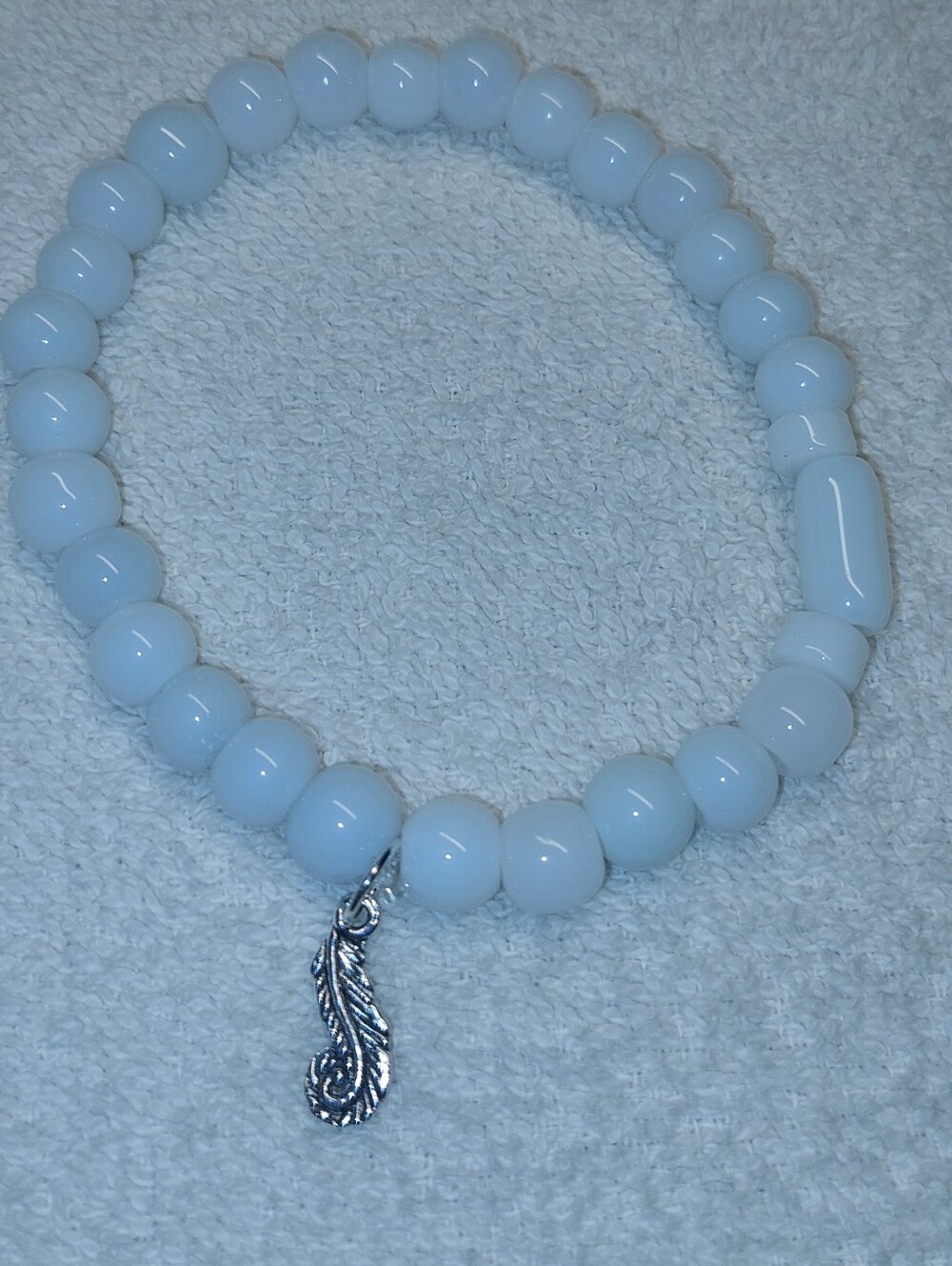 White Glass Beaded Stretch Bracelet with Silver Feather Charm